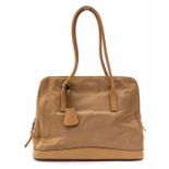 Prada - a beige nylon Prada tote, trimmed in leather, two shoulder handles, one large internal