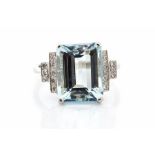 An aquamarine and diamond platinum ring, the step-cut aquamarine approx 6.0 carats, stepped