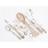 A collection of silver and white metal flatware including: a pair of Continental berry spoons, the