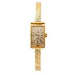 Omega - a ladies Omega De Ville 18ct gold wristwatch, the rectangular silvered dial approx. 11mm