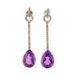 A pair of amethyst and diamond 14ct white gold drop earrings, claw-set with pear shaped amethyst