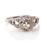 An early 20th Century diamond solitaire ring, the central old-cut diamond weighing approx 1.8