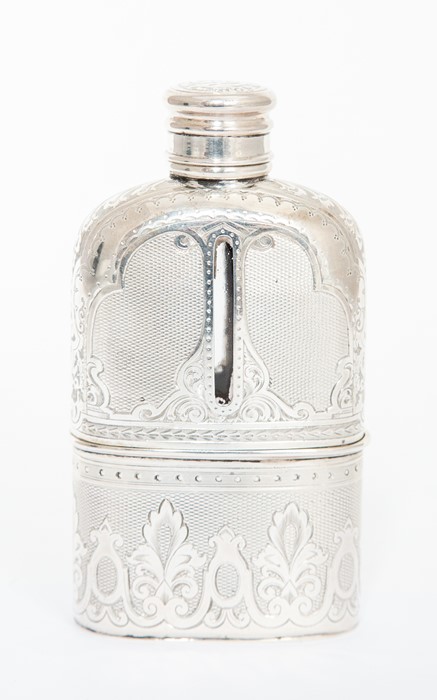 A Victorian silver mounted hip flask, the glass bottle silver mounted in two sections, the fixed top
