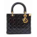 Dior - a Christian Dior Lady Dior handbag in black lambskin leather, cannage stitching with double