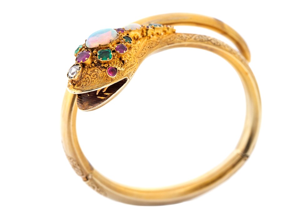 A Victorian opal, ruby, emerald and diamond set serpent bangle, coiled form comprising oval cabochon - Image 11 of 12