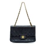 Chanel - a vintage Chanel quilted lambskin double medium flap navy blue hand bag, gold tone