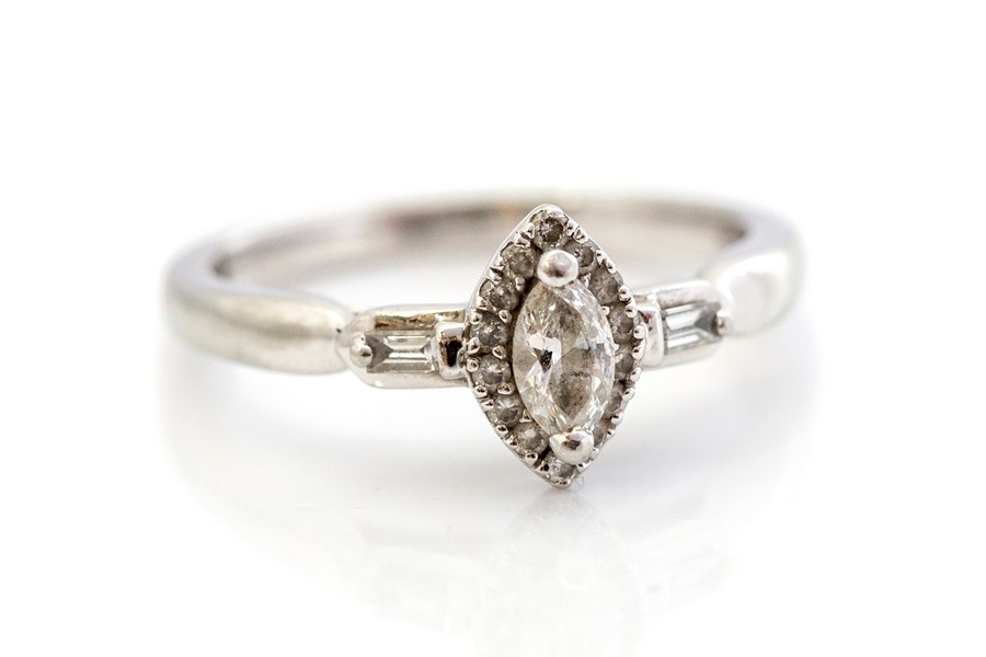 A diamond and platinum solitaire ring, by Emmy London, the centre marquise cut diamond measuring