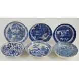 A collection of six early nineteenth century blue and white transfer printed saucers decorated