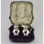 An Edwardian baluster silver sugar sifter and cream jug, maker Elkington & Co, London 1908,