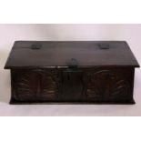 A 17th Century oak bible box, rectangular top with a hinge lid revealing spacious interior, above