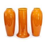 A new pair of Bretby Art Pottery baluster vases with yellow glaze decoration and a similarly