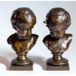 A pair of bronze busts of children, each measuring 26cm high (2)