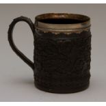 A late eighteenth century Wedgwood black basalt mug with silver rim, circa 1790. It is decorated