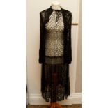 Two lace dresses. One is 1920s with an A Line skirt and matching Bolero and the other from the early