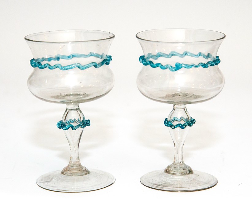 A pair of facon de Venise wine glasses with blue can decoration, possibly Venice circa 1700,