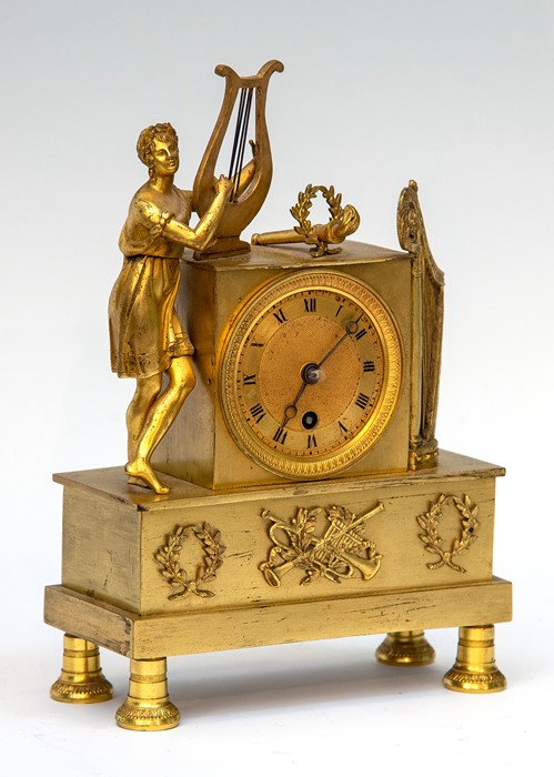 A 19th Century gilt metal boudoir timepiece of Empire design, surmounted with a classical maiden - Image 2 of 2