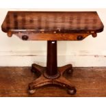 A George IV rosewood card table, circa 1820, rounded rectangular hinge fold over twist top enclosing