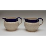 Two large Chetham and Woolley feldspathic stoneware jugs with blue rims, circa 1810. Each is