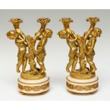 A pair of 19th Century French gilt bronze figural candelabrum, in the form of children holding