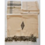 A 1920's silk long fringed gents evening scarf, in deep cream silk, with an Art Deco emblem by A