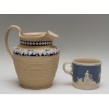 An early nineteenth century feldspathic stoneware jug, circa 1810 with reeding to the body and