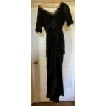 Black lace and satin early Edwardian Dress with Elbow length sleeves in lace, the bodice is of an