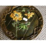A Bretby Art Pottery wall plaque simulating natural wood with applied flowers and insect decoration,