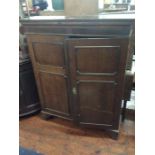 A George III mahogany bookcase cabinet, circa 1820,moulded cornice, above two panelled doors with