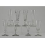 A collection of eight hand blown fluted glasses, comprising two pairs of champagne flutes and four