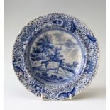An early nineteenth century blue and white transfer printed Durham Ox series soup dish, circa 1810-