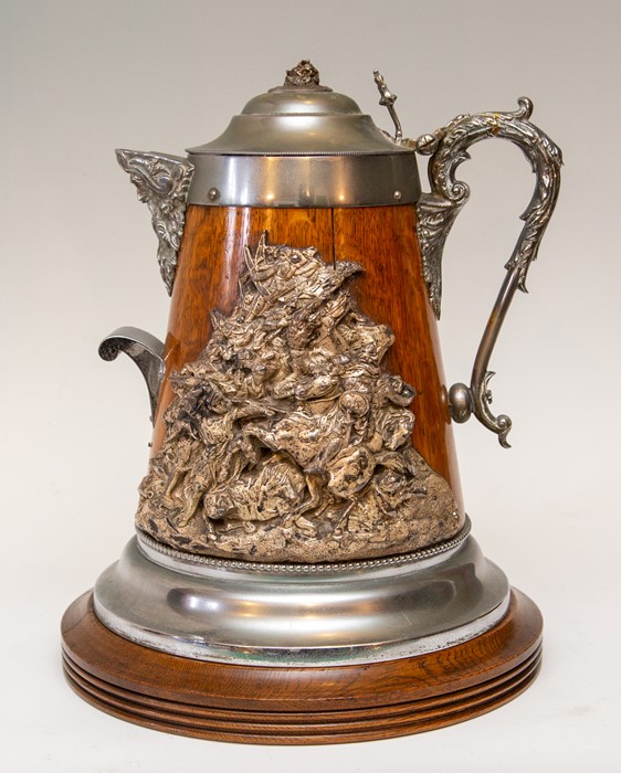 A late Victorian oak ceremonial pitcher, circa 1890, nickel and electrotype mounts, hinged cover