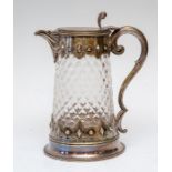 A Victorian moulded glass country house claret jug, electroplated Gothic mounts hinged cover with