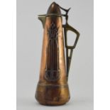 A Jugendstil copper and brass lidded pitcher, circa 1910, height 37cm