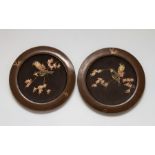 A pair Bretby art pottery bronzed wall plaques with 'cloisonne' decoration of birds on branches