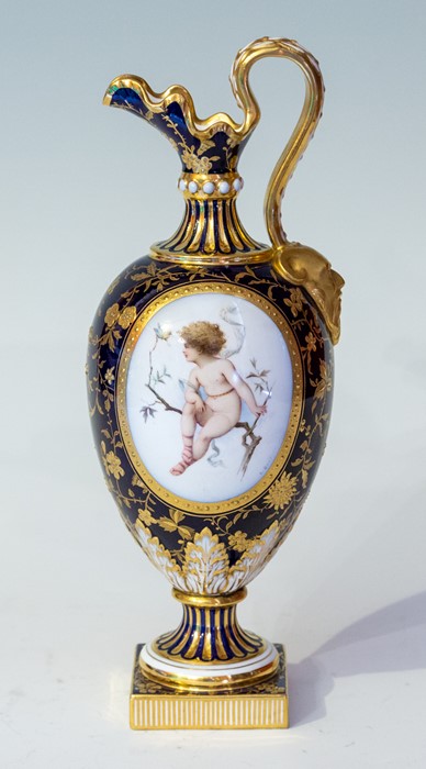 A Mintons hand painted ewer, early 20th Century, with foliage decoration on a blue ground, with a