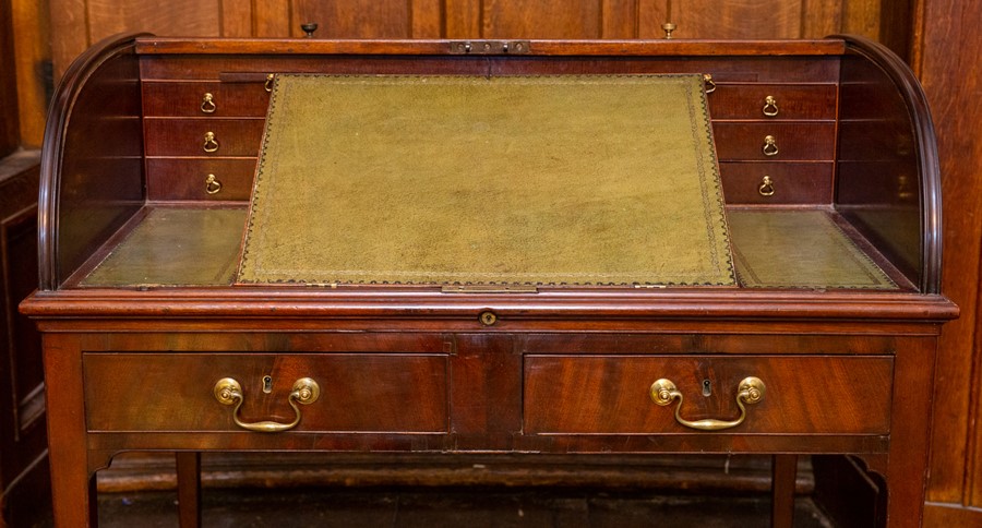 A William IV mahogany tambour cylinder top writing desk, circa 1830, in the manner of Gillows