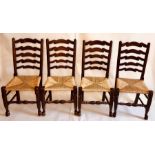 A set of ten early 19th and later century elm rush seated chairs, circa 1810, ladder back with