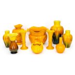 A group of Bretby art pottery yellow glazed vases of various shapes including gourd: Largest 23 cm