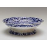 An early nineteenth century blue and white transfer printed footed cheese stand, circa 1825. It is