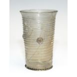 A tall pale green glass beaker with trailed decoration, German, circa 1520, height 16cm Condition: