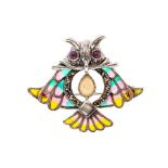 A silver plique a-jour enamel brooch/pendant in the form of an owl, ruby set eyes, pear shaped