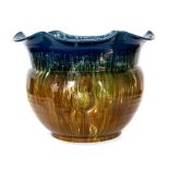 A Bretby Art Pottery large jardiniere with moulded circle decoration and blue, green and brown