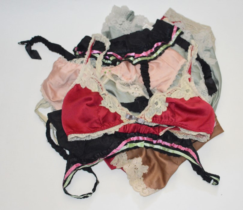 A collection of 1970s Janet Raeger under garments to include suspender belts and matching bras and 2