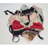 A collection of 1970s Janet Raeger under garments to include suspender belts and matching bras and 2