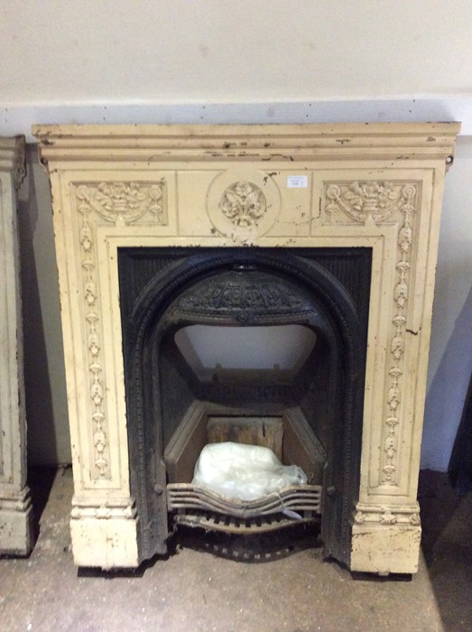 Three Victorian cast iron bedroom fire surrounds, of various designs, measuring 96cm x 79cm, 96cm