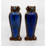 A pair of Bretby art pottery bronzed and jewelled baluster vases with inset blue-glaze panels, No.