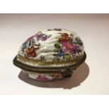 An early 19th Century Continental porcelain trinket box, in the form of a walnut, florally