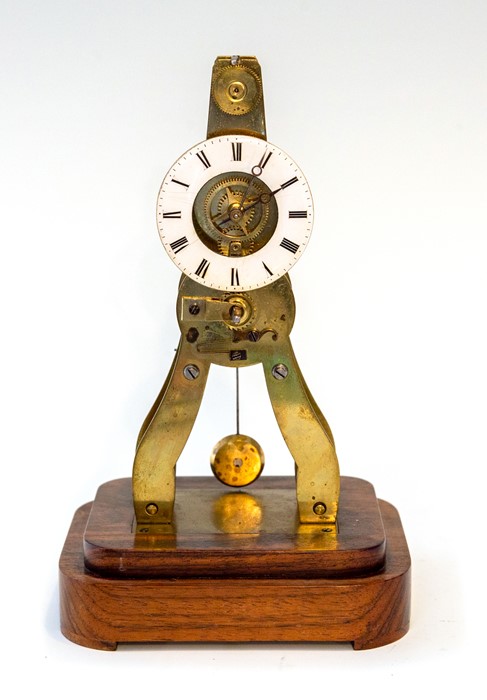 A late 19th Century small French brass skeleton clock signed Ms Honorables, Paris & Londres, 5cm