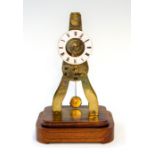 A late 19th Century small French brass skeleton clock signed Ms Honorables, Paris & Londres, 5cm