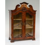 An 18th Century mahogany miniature or apprentice vitrine, oak carcass, arched and broken scroll
